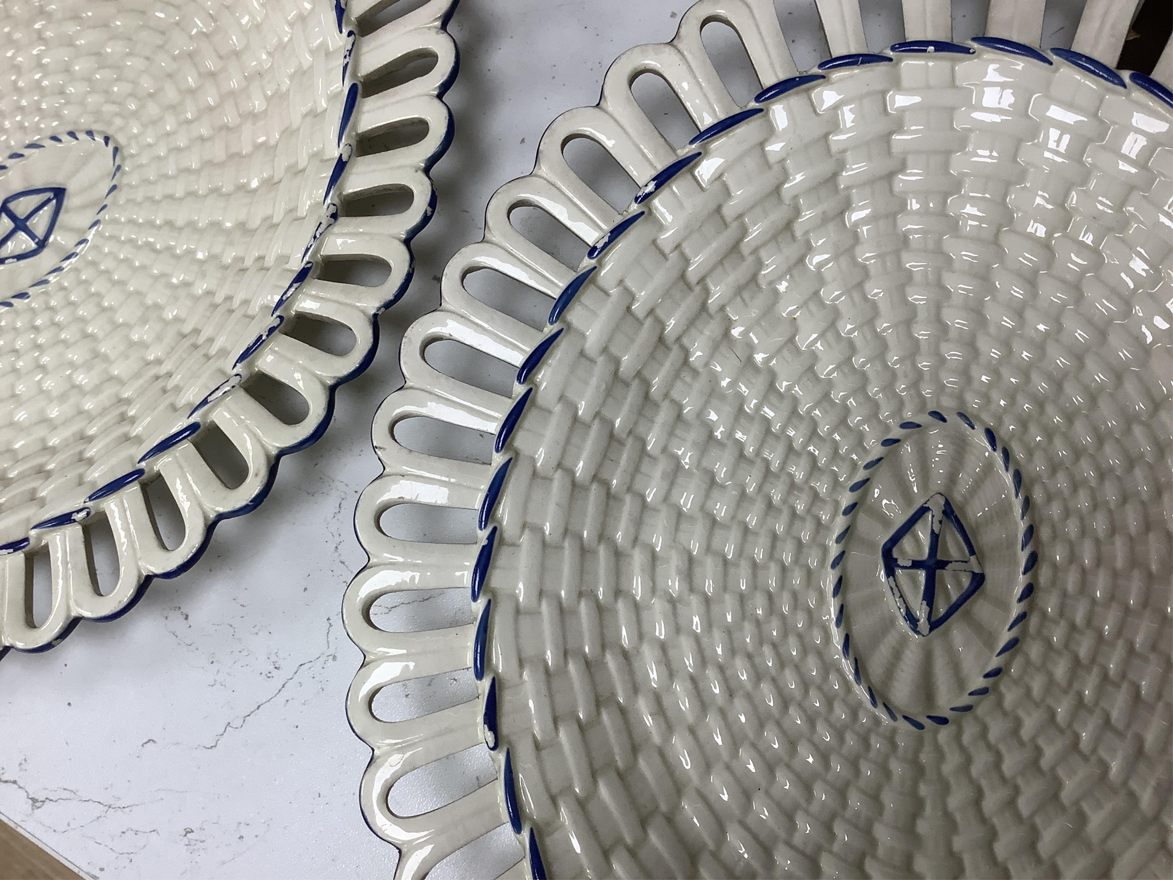 Two early 19th century Wedgwood Queensware oval twig baskets and three oval dishes. Largest basket 28cm wide.